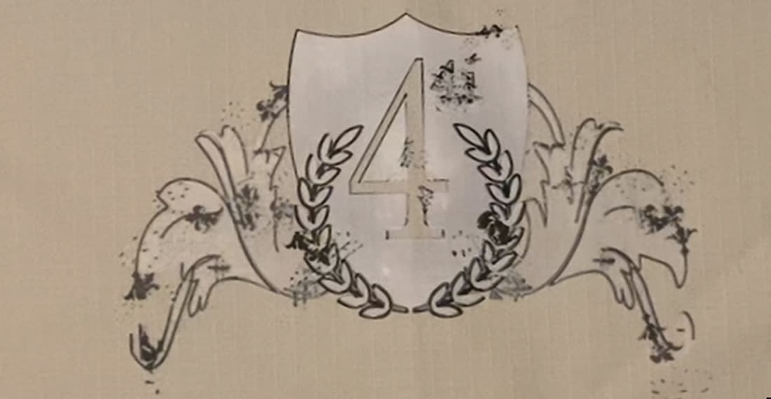 Escudo bordado — detalle